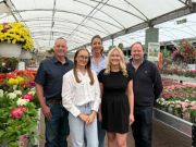 Charles Phillippa and Robert Stubbs stand behind Libby and Amy Stubbs
